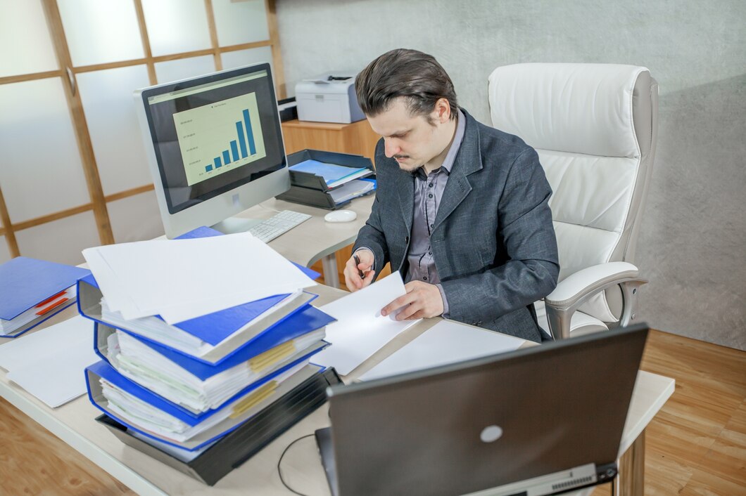 young-businessman-working-from-his-office-concept-hard-work_181624-26431